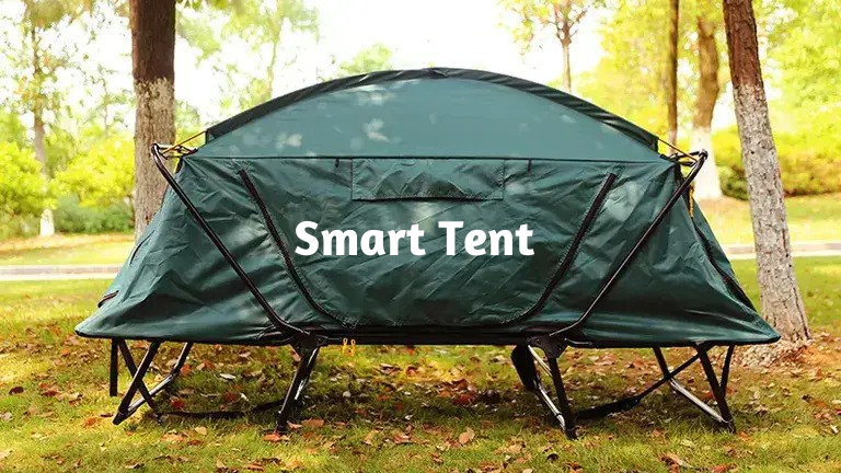 Smart tent on open ground surrounded by green trees, no people visible