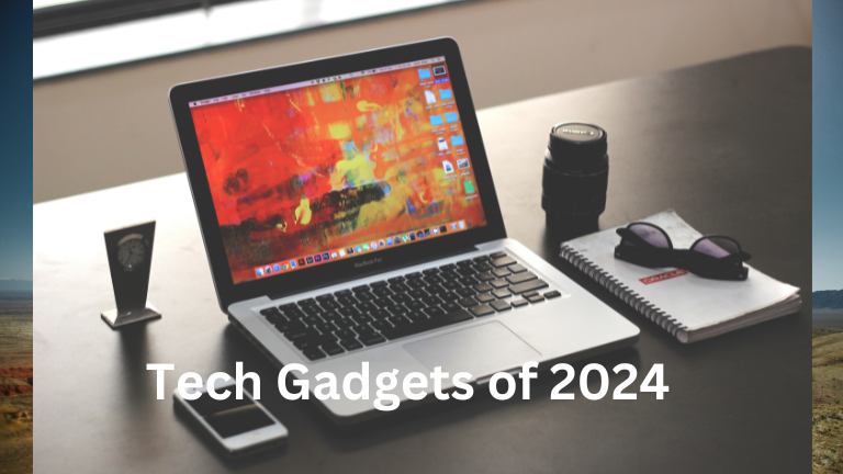 Tech Gadgets of 2024: symbolic image of post where a laptop, smartphone and a camera lance are on the table.